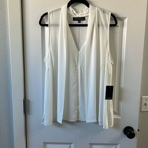 Drape front white sleeveless blouse